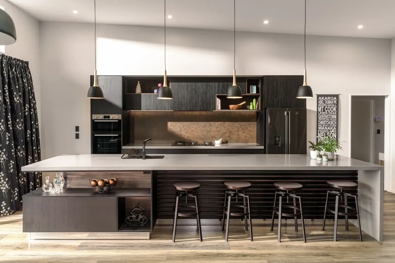 A kitchen with a large island and stools