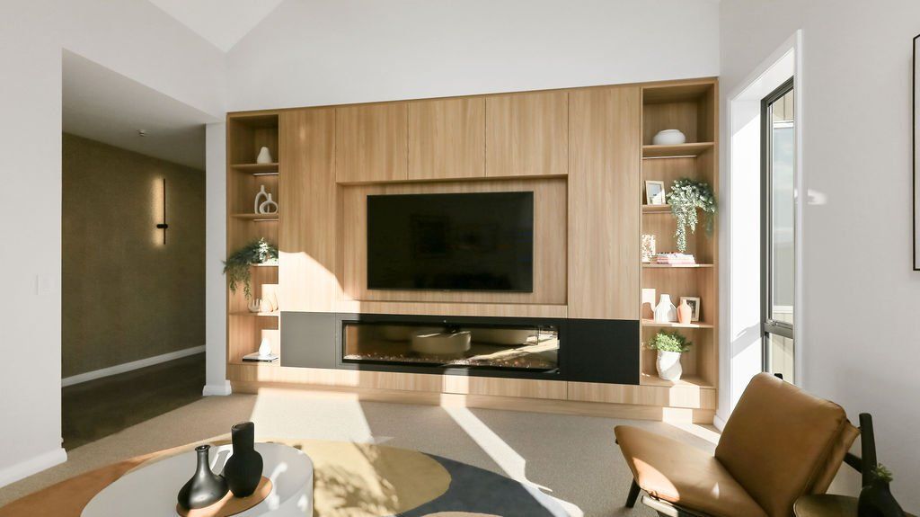 A living room with a large flat screen tv on the wall.
