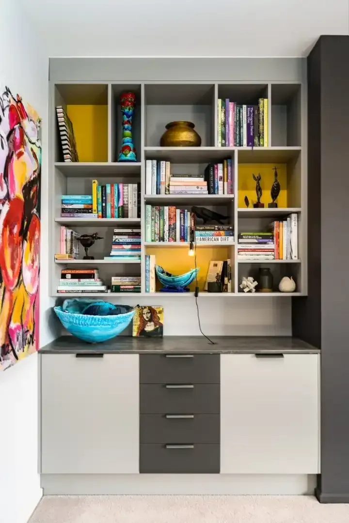 There are many books on the shelves in this room.