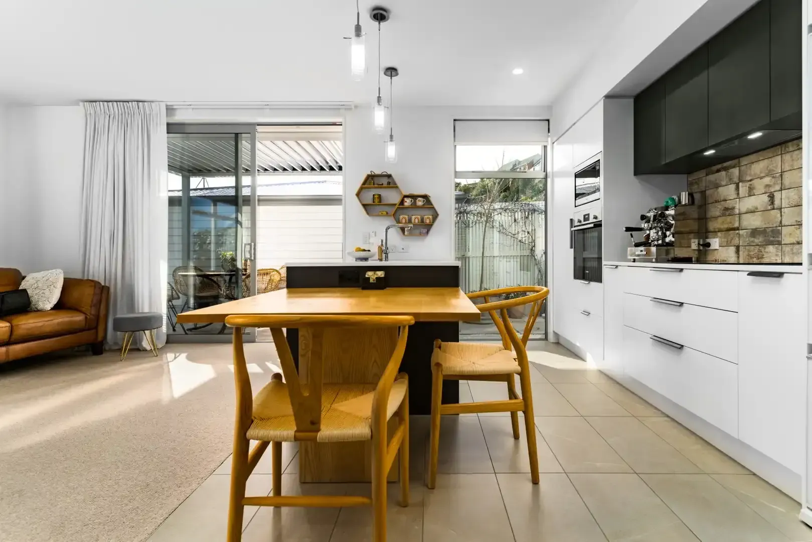 A kitchen with a table and chairs in it