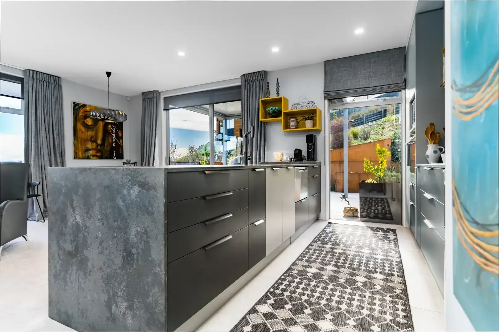 A kitchen with a large island in the middle of it