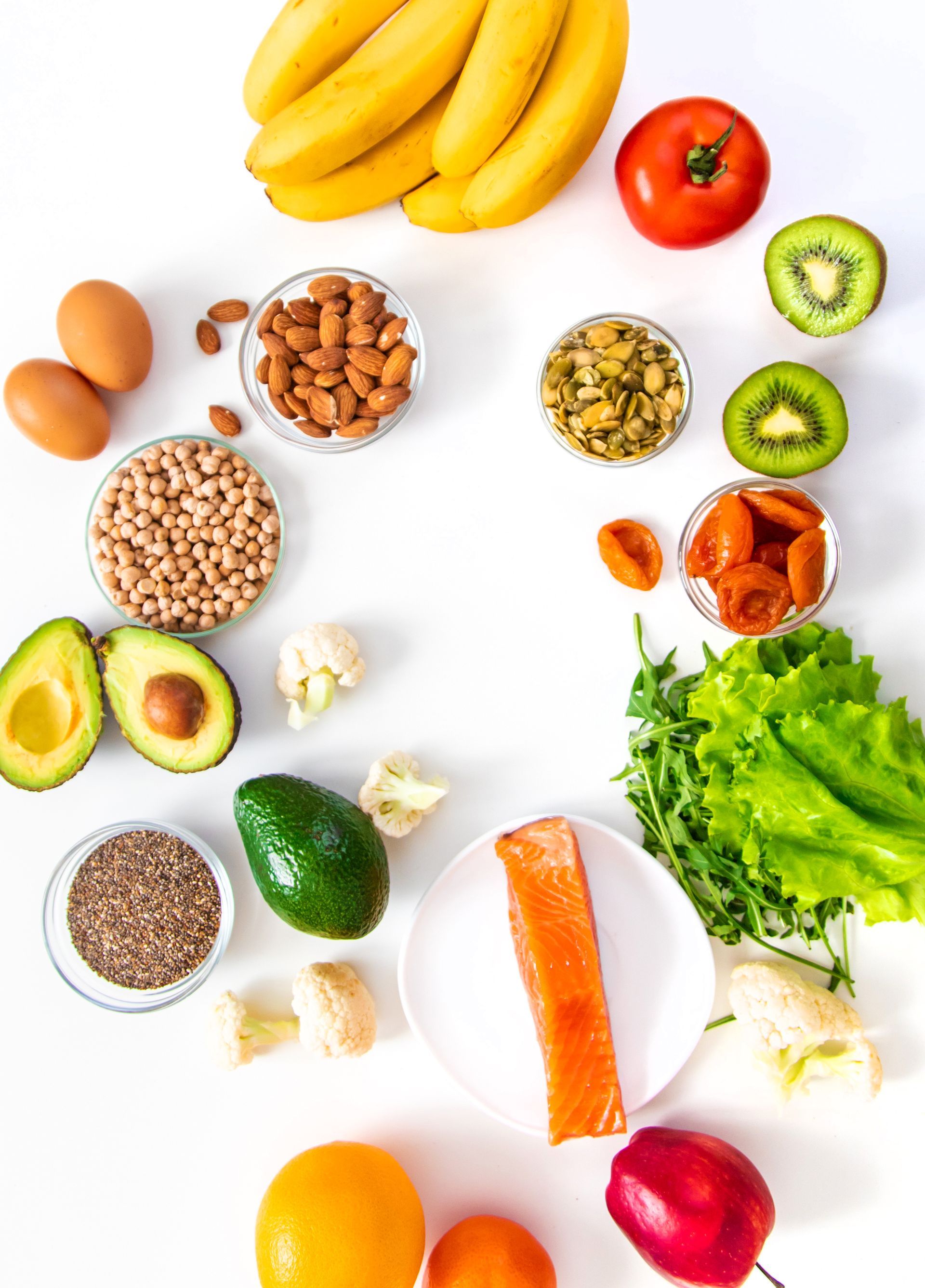 There are many different types of fruits and vegetables on the table.