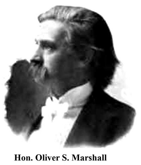 Portrait of Hon. Oliver S. Marshall in profile, with a long beard and formal attire.