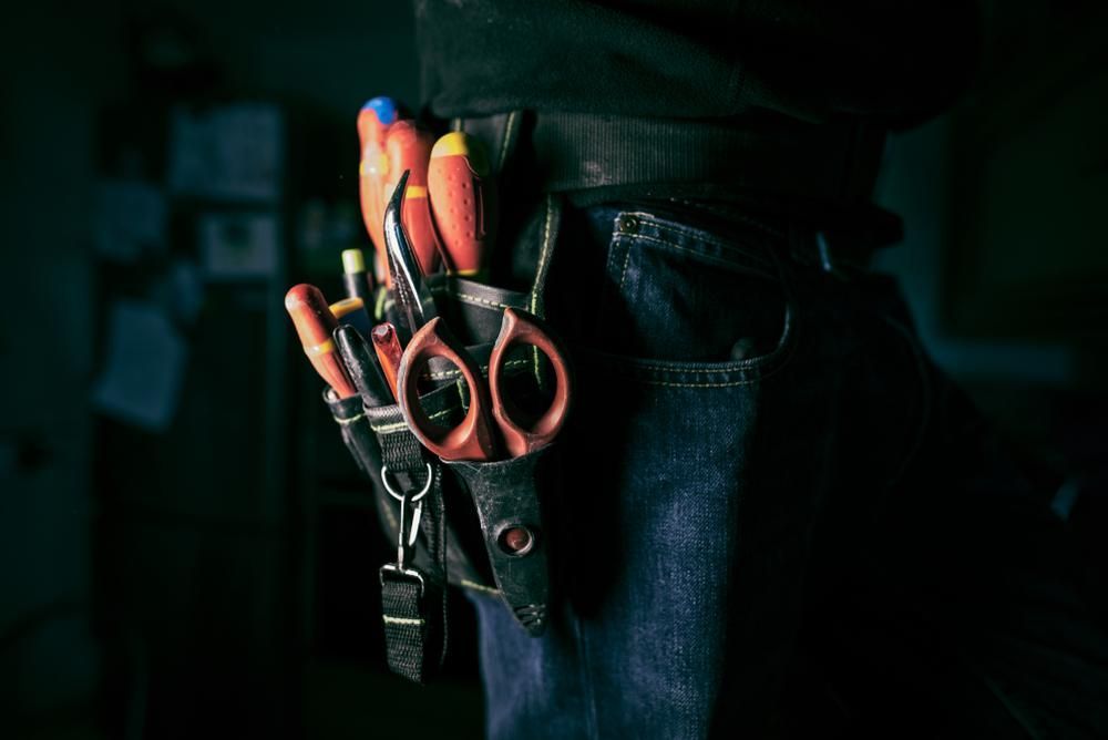A Person Is Wearing A Tool Belt With Tools In It — Accent Electrics In Noraville, NSW