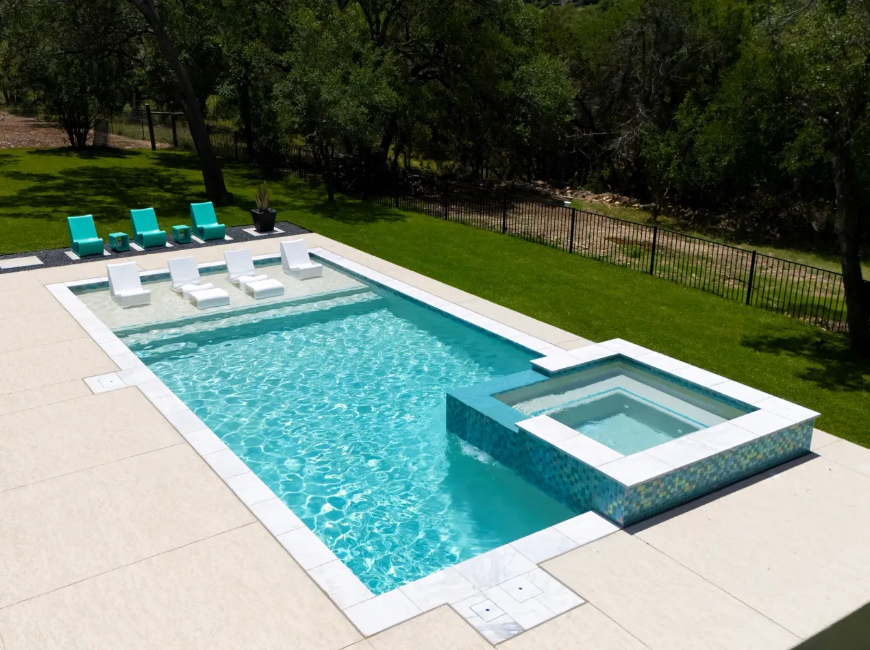 Happy pool construction customer in new swimming pool.