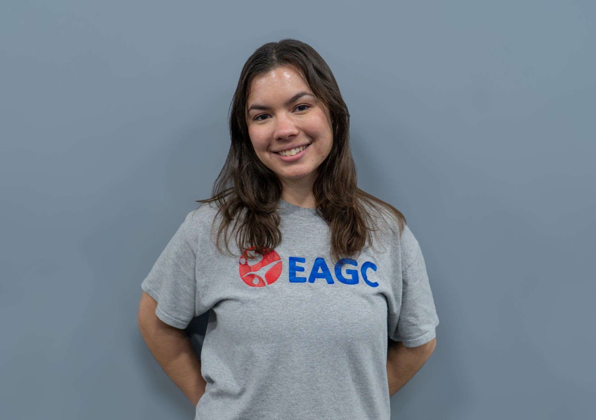A woman wearing a red shirt that says friday on it