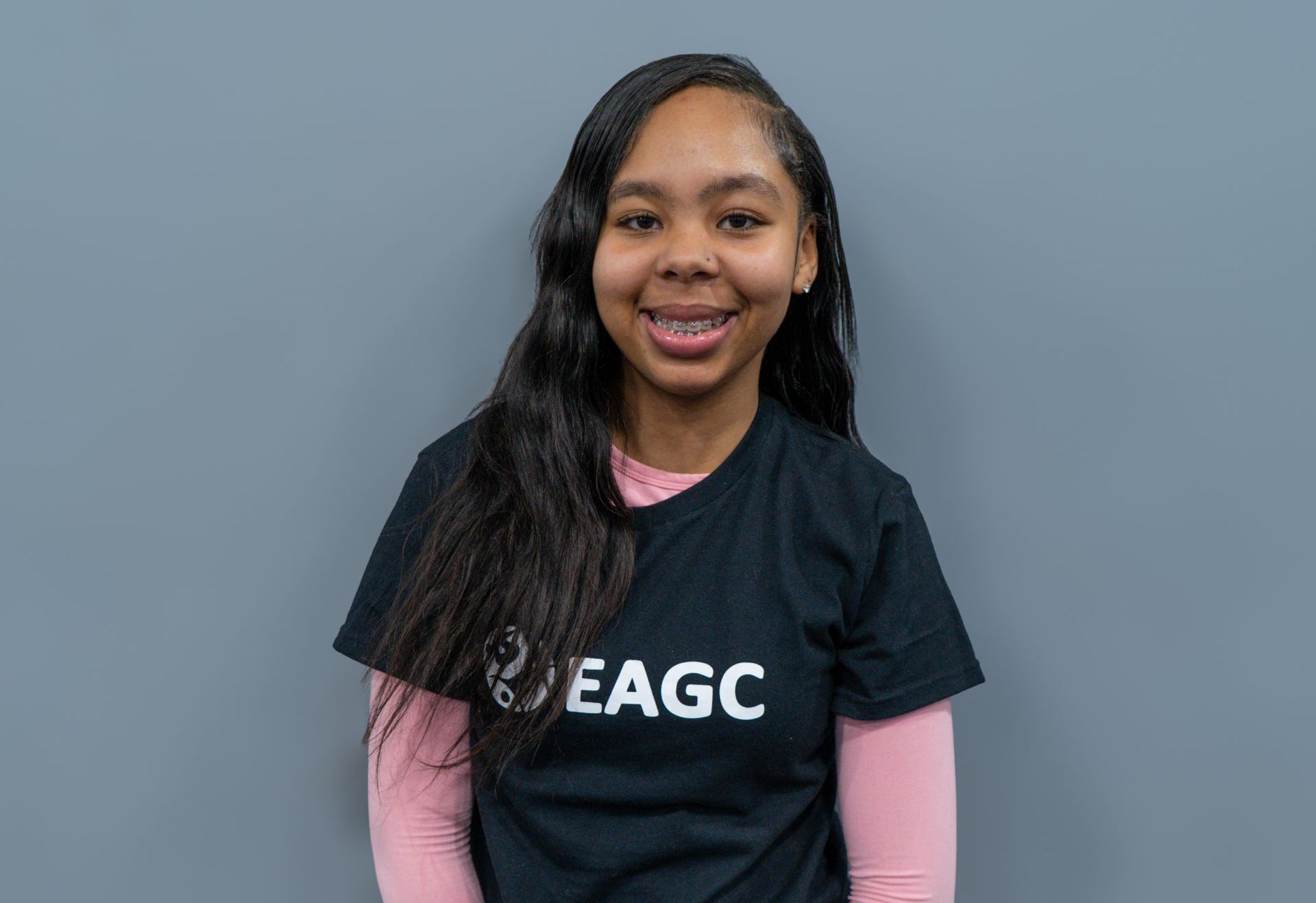 A Female Rec Coach wearing a black EAGC Tshirt