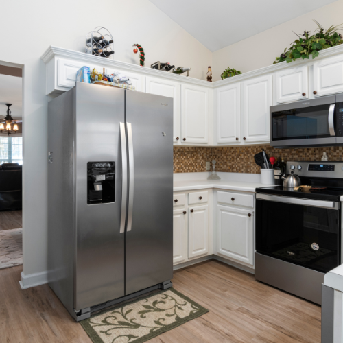 Stainless Steeel shiny refirgerator in updated kichen
