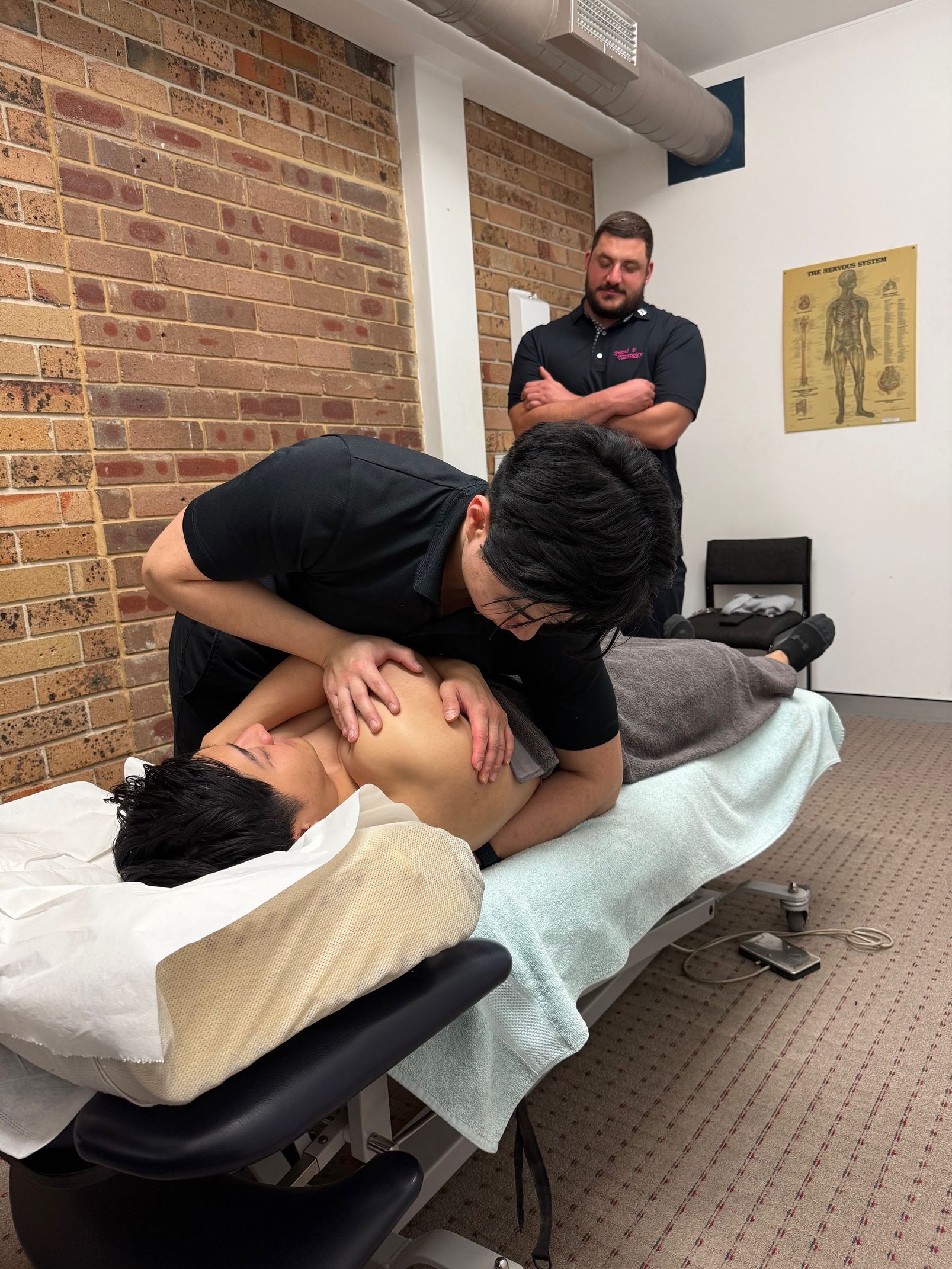 Man getting a spinal twist From A Doctor — Spinal Symmetry In Salamander Bay, NSW