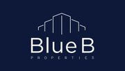 Logo for Blue B Properties featuring white text and a building design on a navy blue background.
