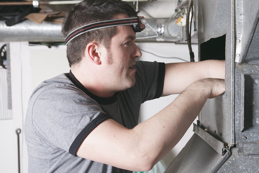 worker checking the furnace