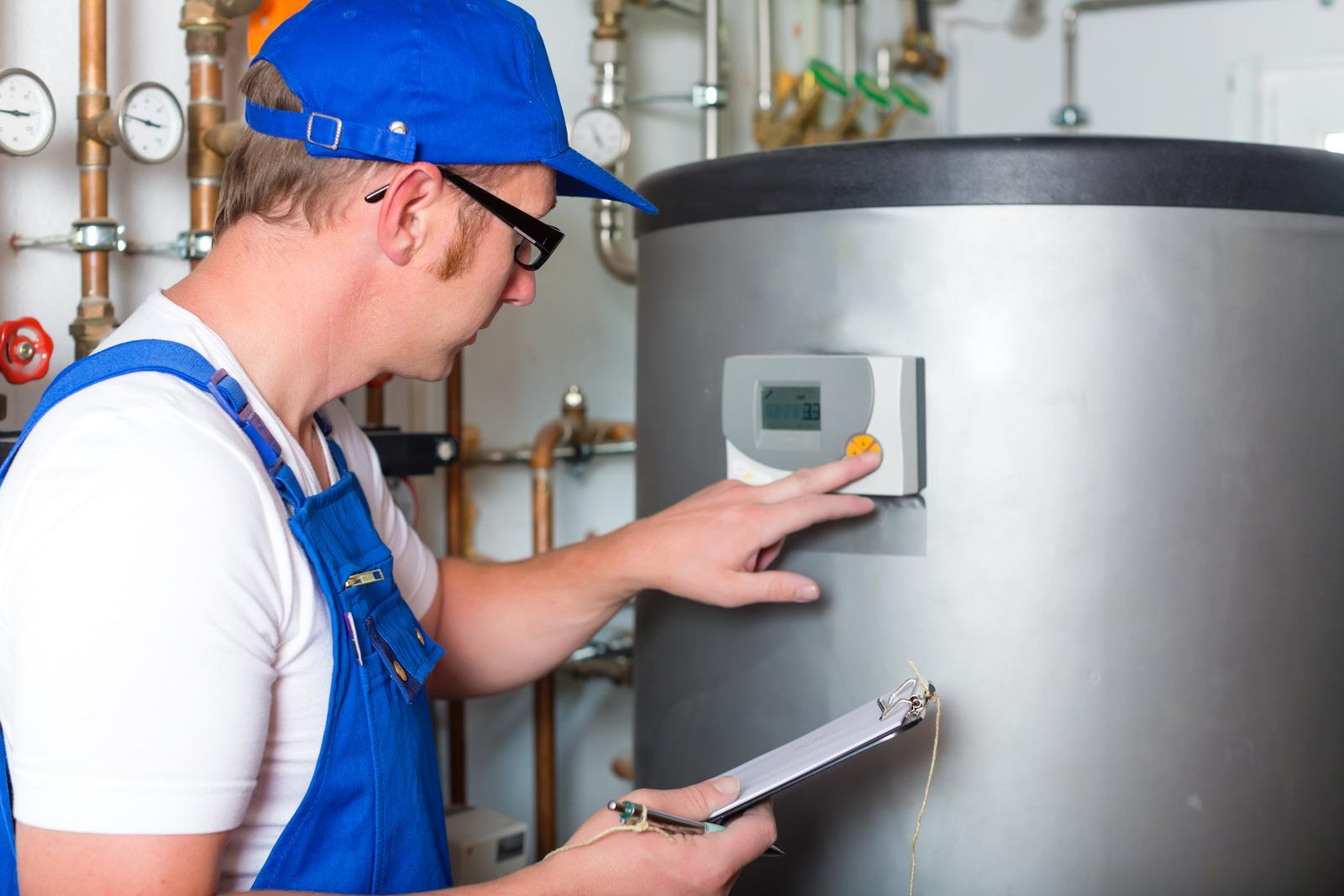 worker operating the gas furnace