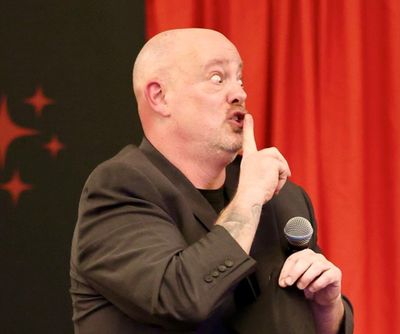 Corporate magic entertainer Matt Redlaw performing close-up magic for four people