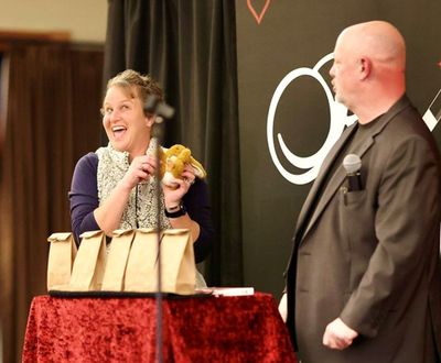 Corporate magic entertainer Matt Redlaw performing close-up magic for two people