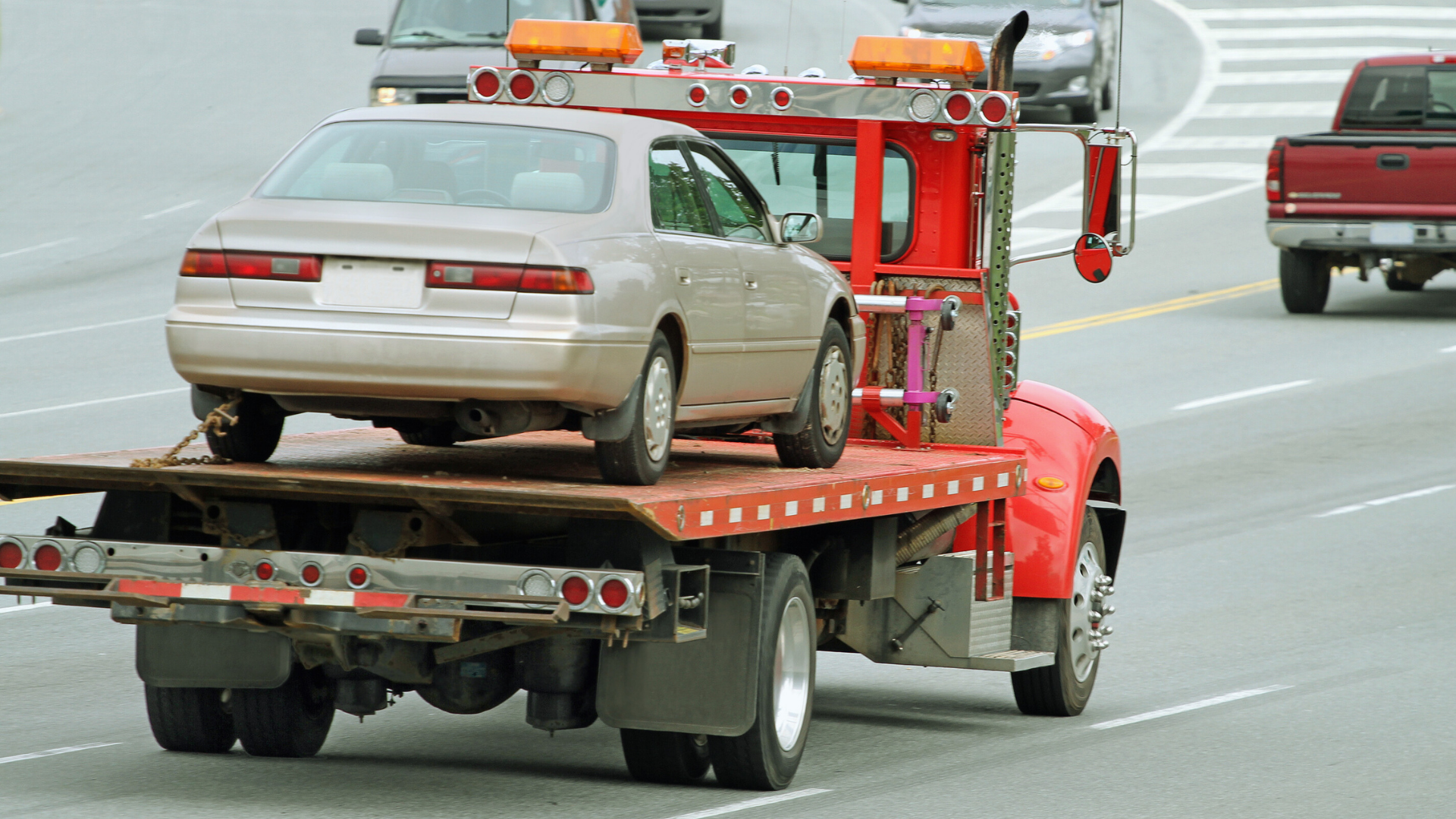 Branded Lethbridge Towing Experts truck on city street