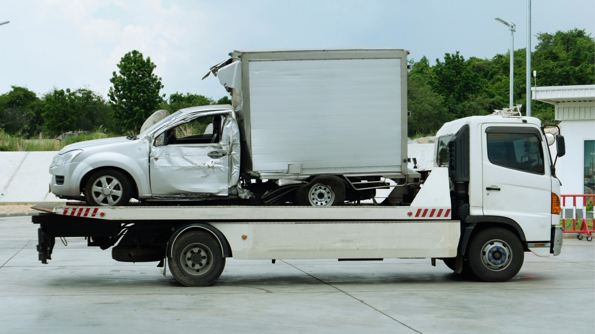 Service professionals coordinating towing for commercial vehicle