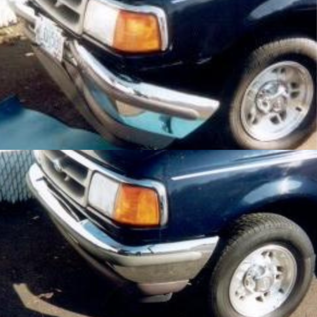A worker in white gloves applying red vinyl wrap to the side of a car.