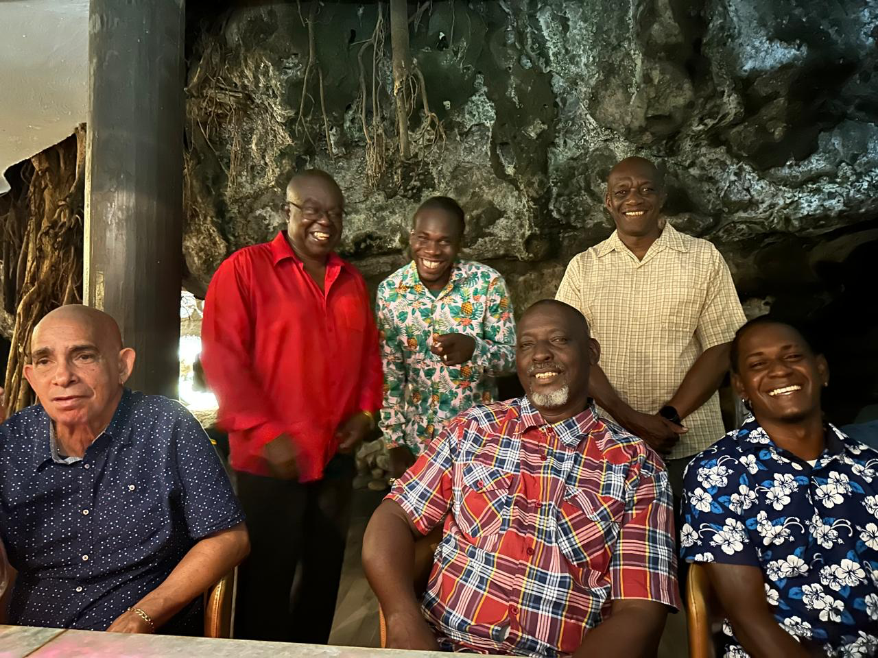 A group of men are posing for a picture together