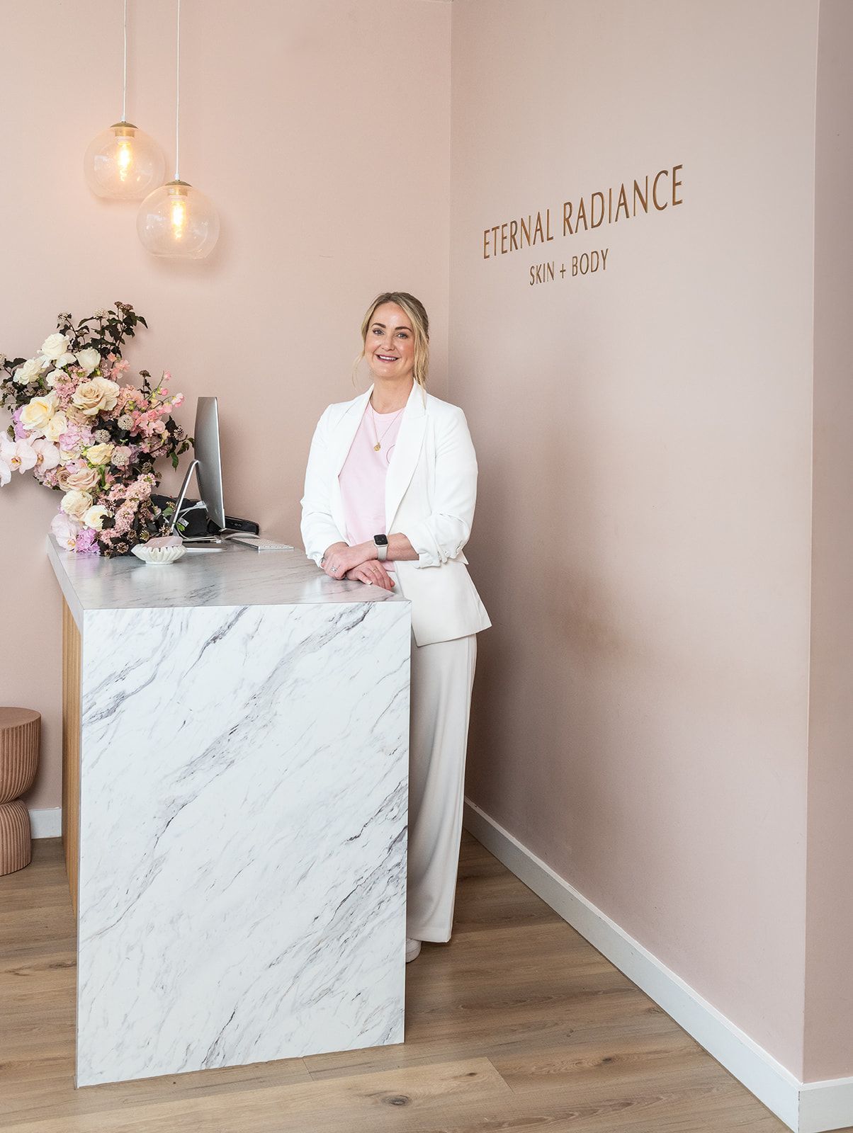 Woman Receiving Eyelash Extensions in a Salon, With Technician Leaning Over Her — Eternal Radiance in Strathmore, VIC