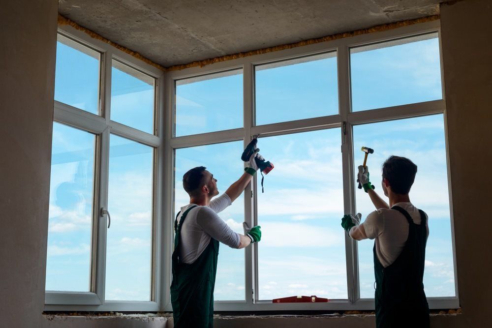 Two Workers Working On The Glass — Glass Replacements in Rockhampton, QLD