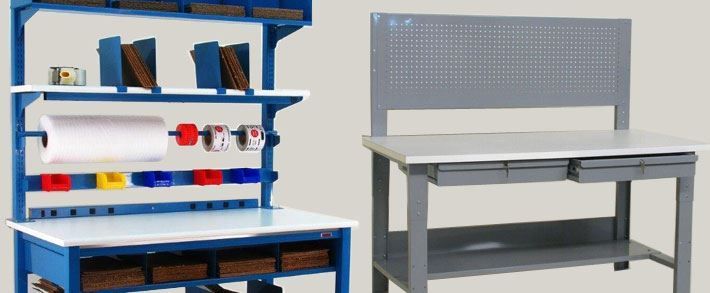 Two workbench with shelves and drawers on them are sitting next to each other.