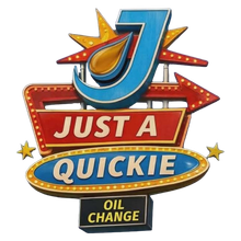 Vintage &ldquo;Just a Quickie&rdquo; oil change sign with a large blue J and red arrow accents.