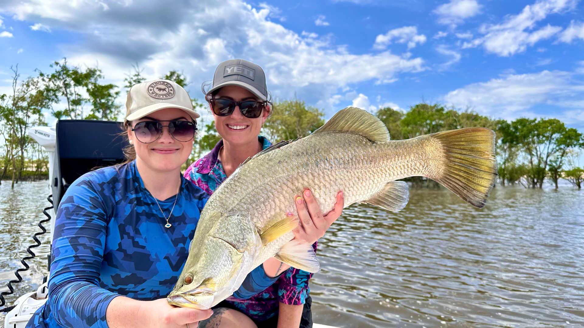 A Man Is Standing At A Counter In A Kitchen On A Boat — Territory Barra Sportfishing In Zuccoli, NT