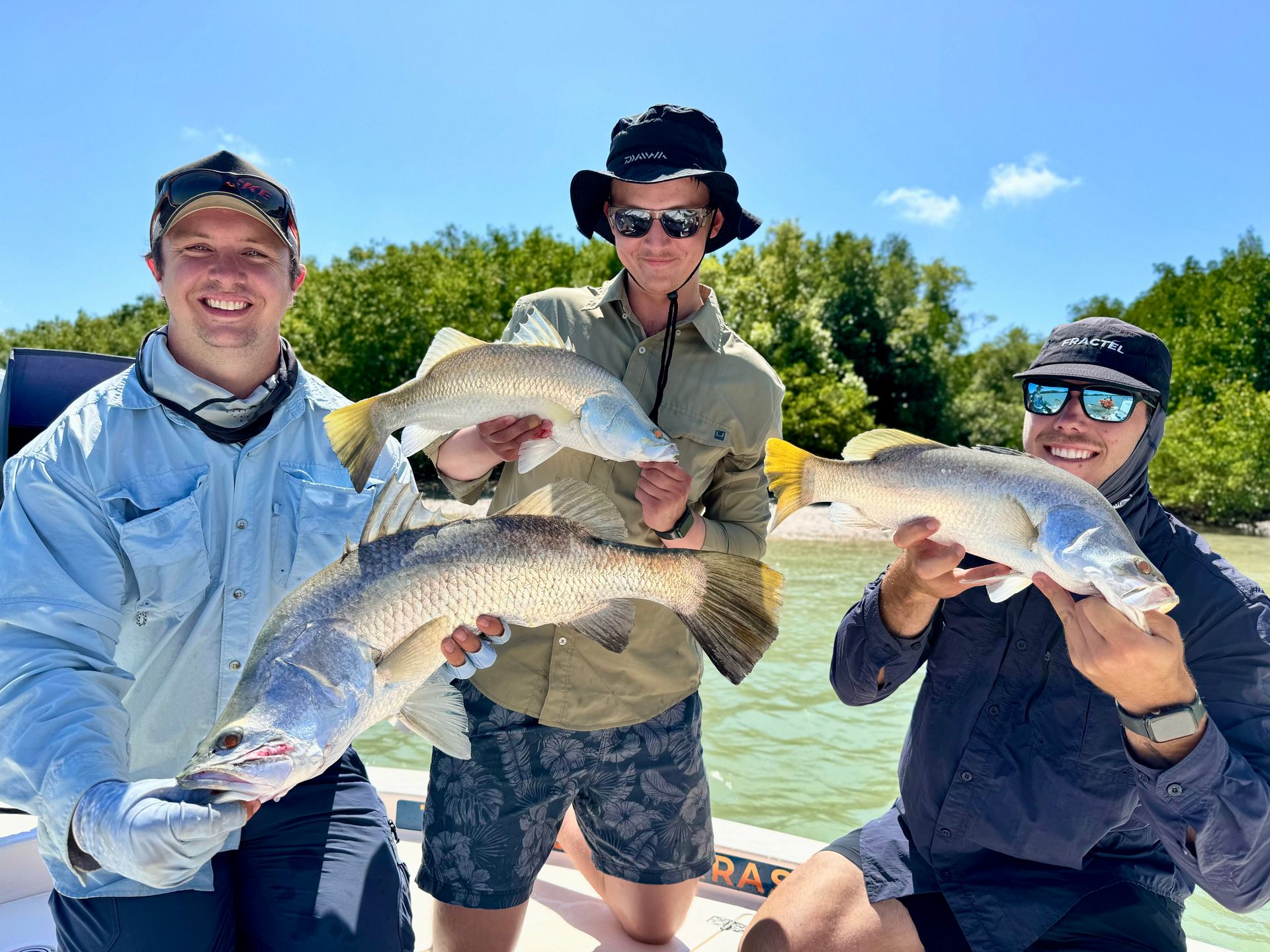 A Large Boat Is Floating On Top Of A Body Of Water Next To A Smaller Boat — Territory Barra Sportfishing In Zuccoli, NT
