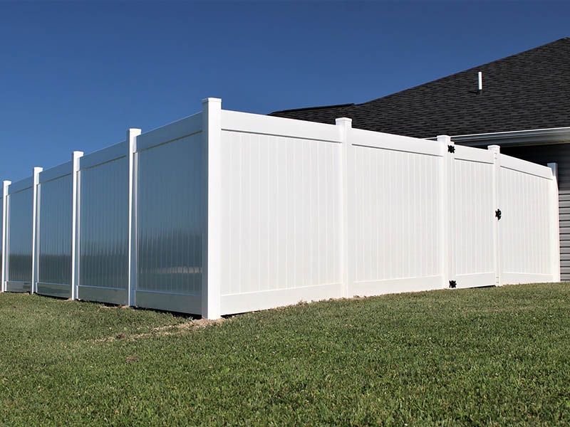 Vinyl installed in Glyndon, Minnesota with clean white panels offering privacy, curb appeal, and low-maintenance protection.