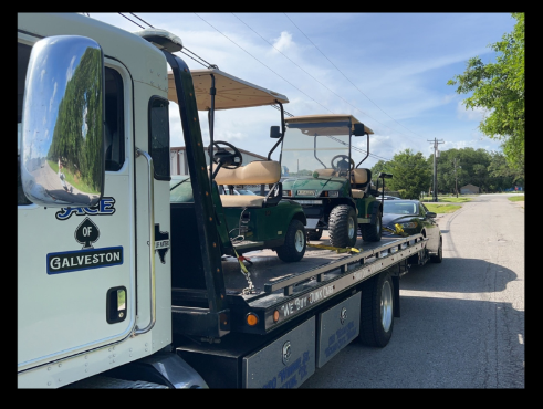 golf carts on tow truck