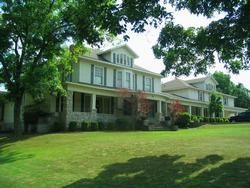 Exterior view with trees of Qualls-Batesville Funeral Service in Batesville, AR