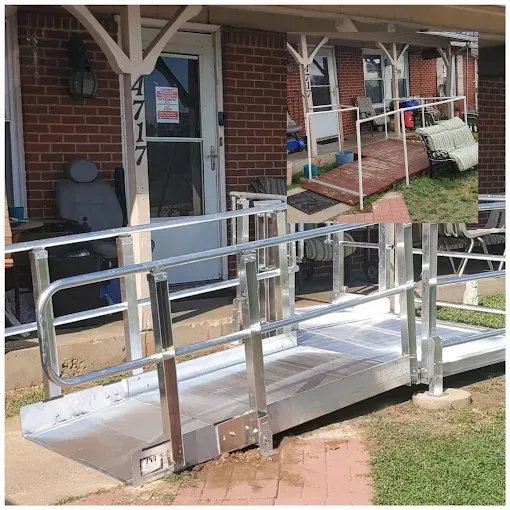A modular aluminum wheelchair ramp installed at the front entrance of a brick house, replacing a previous wooden ramp.