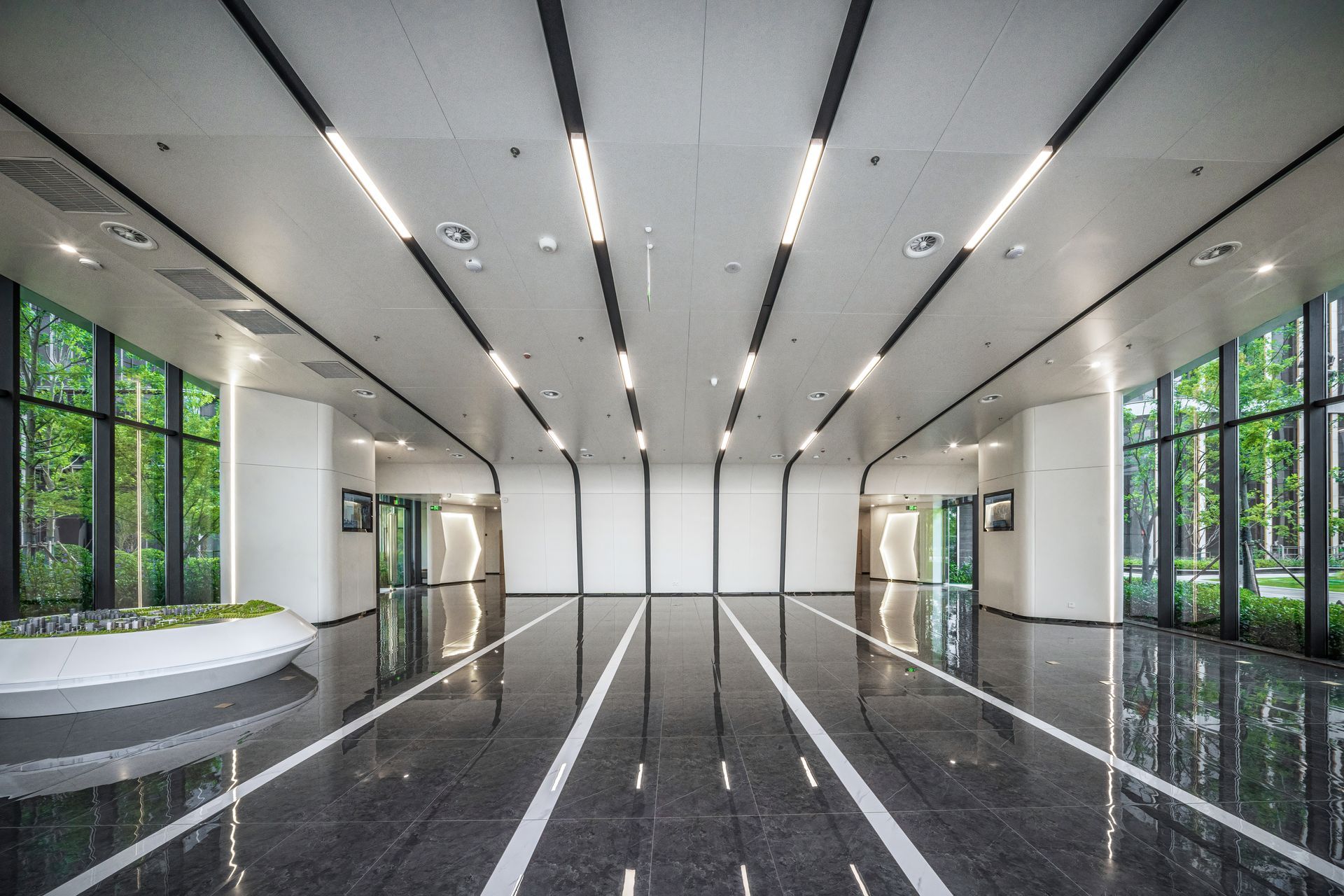 Bright office interior with LED lighting surrounded by nature.