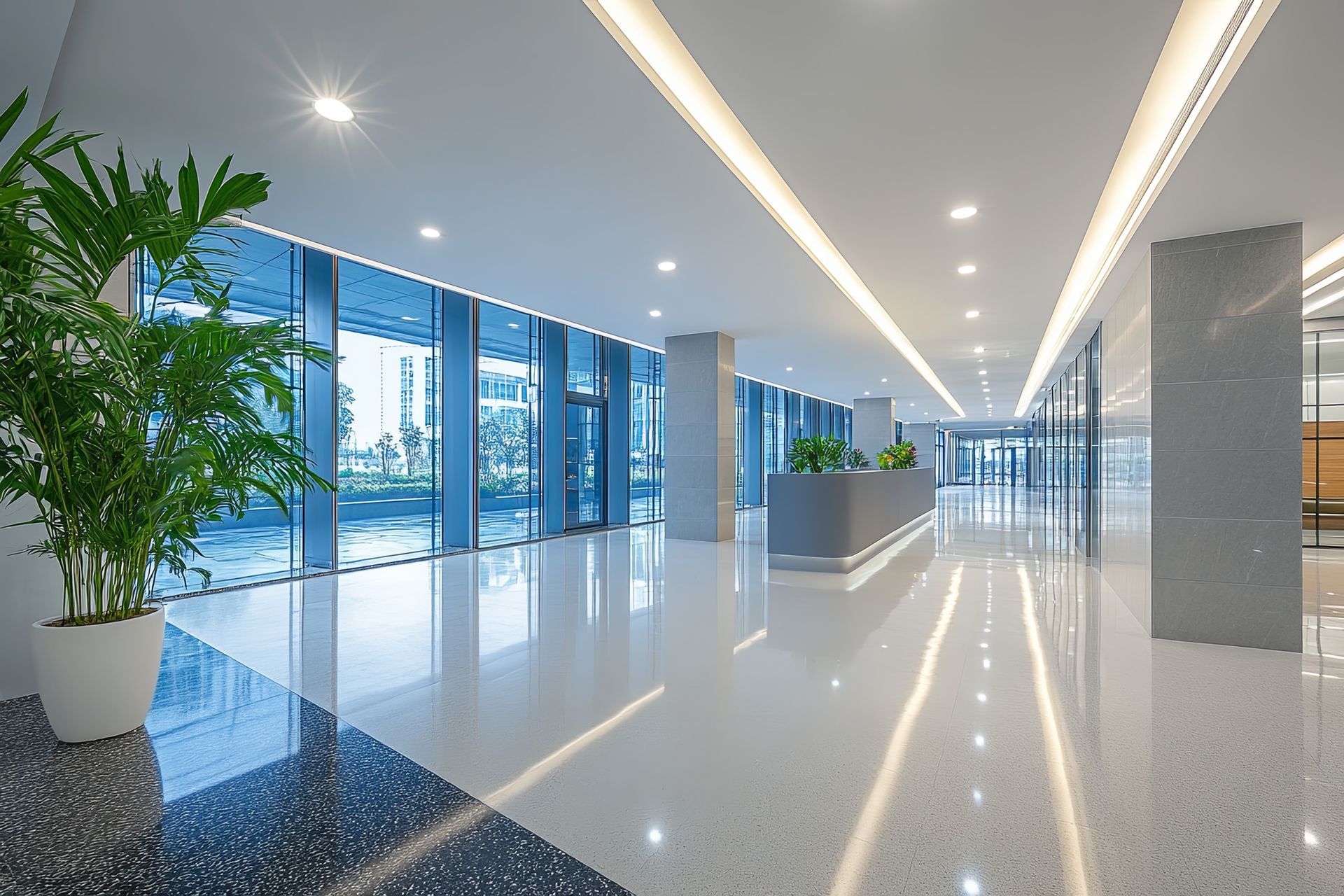 Modern commercial building lobby with energy-efficient LED lighting installation throughout the ceiling and corridor Modern commercial building lobby with energy-efficient LED lighting installation throughout the ceiling and corridor