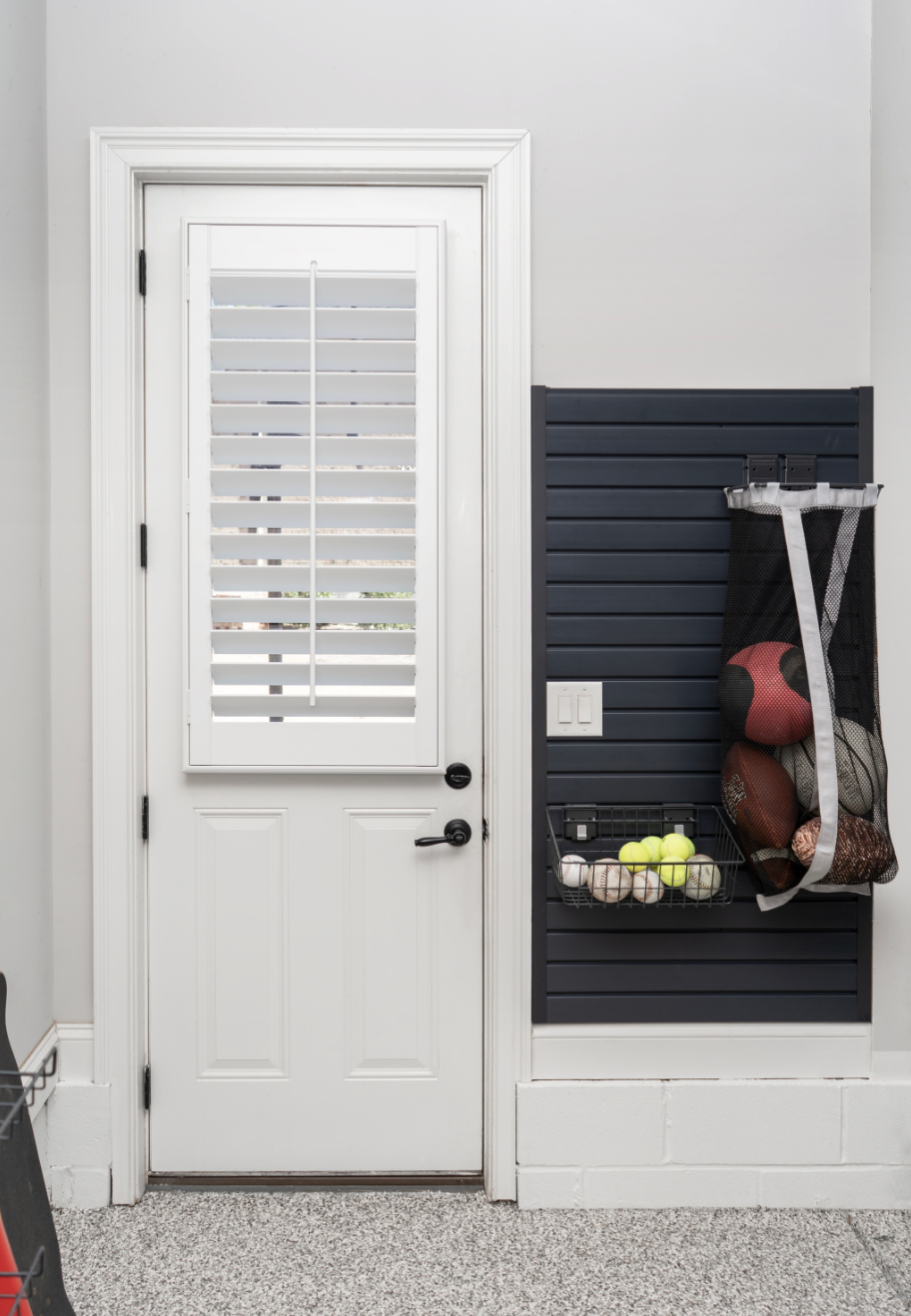 An Artisan Plantation Shutter on a Garage Door