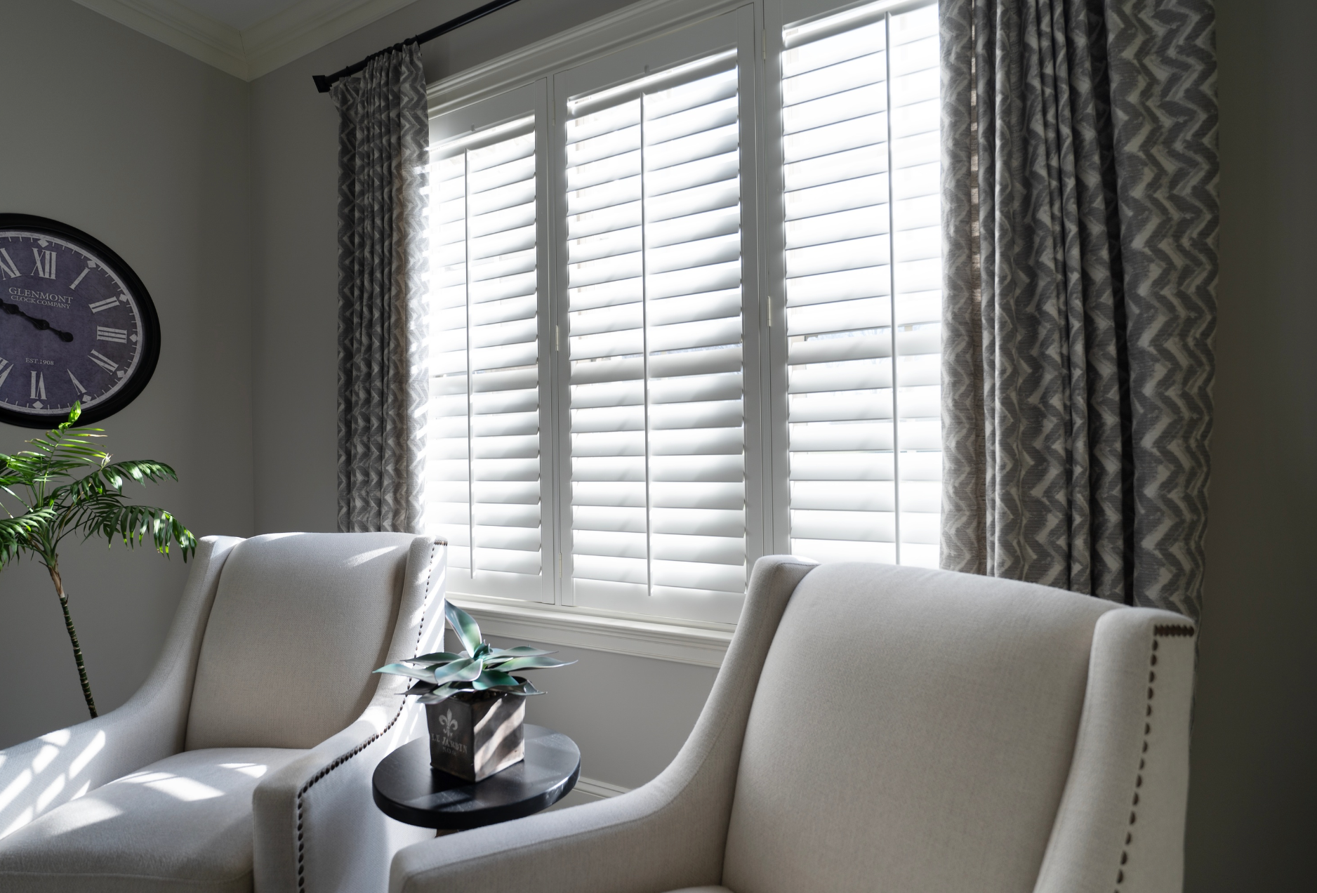 Triple plantation shutters in an office