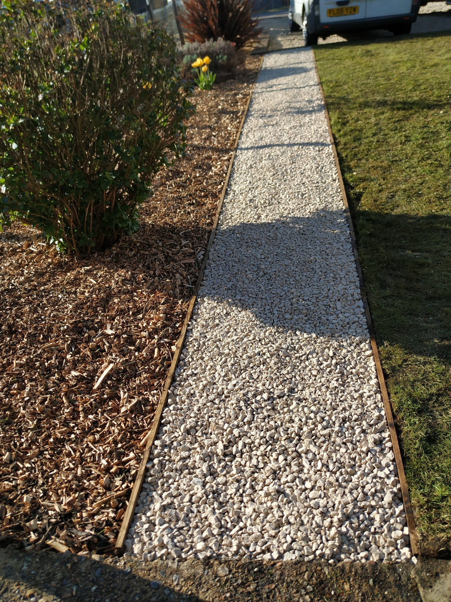 Cotswold stone path with wooden border