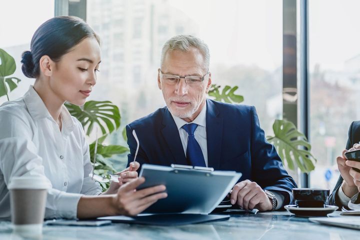 Business People Working On Business Contract Papers At Office — Placida, FL — Accounting 4 Profitability LLC
