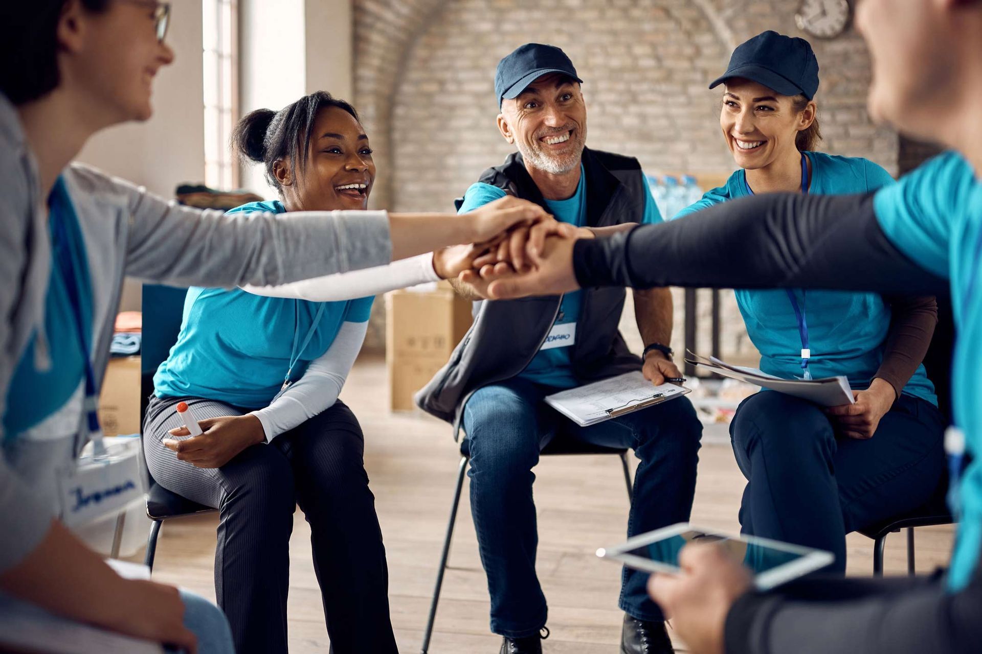 Team Of Motivated Volunteers Gathering Hands In Unity After Successful Meeting — Placida, FL — Accounting 4 Profitability LLC Team Of Motivated Volunteers Gathering Hands In Unity After Successful Meeting — Placida, FL — Accounting 4 Profitability LLC