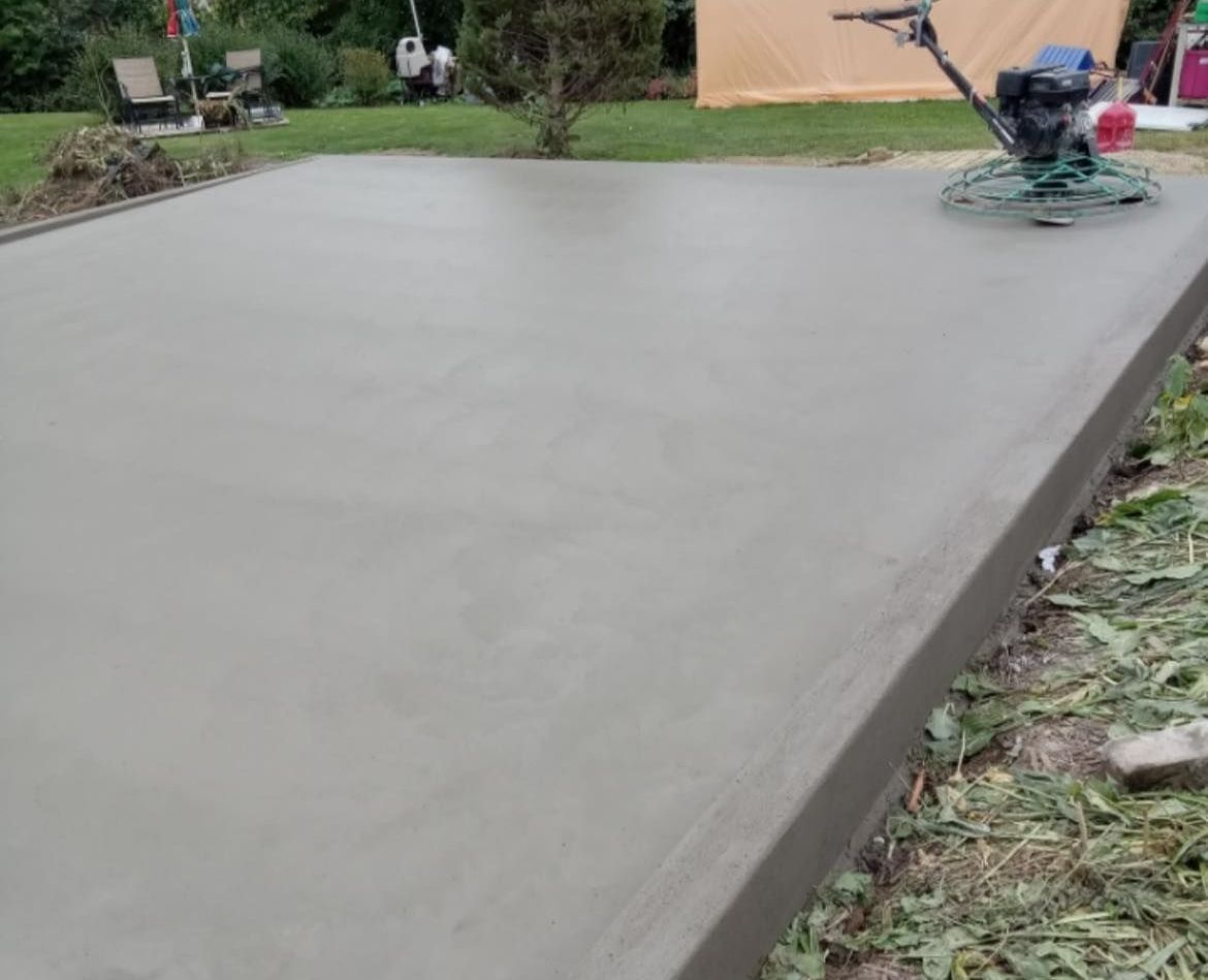 Concrete Driveway Surrounded by Trees – Moline, IL – QCFI Concrete & Masonry Concrete Driveway Surrounded by Trees – Moline, IL – QCFI Concrete & Masonry