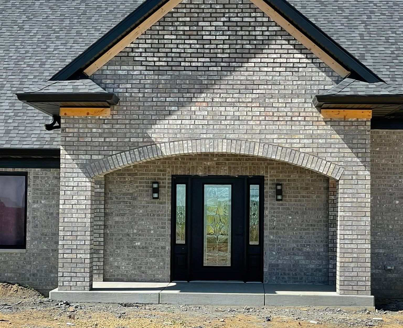 Brick House with a Red Door – Moline, IL – QCFI Concrete & Masonry Brick House with a Red Door – Moline, IL – QCFI Concrete & Masonry