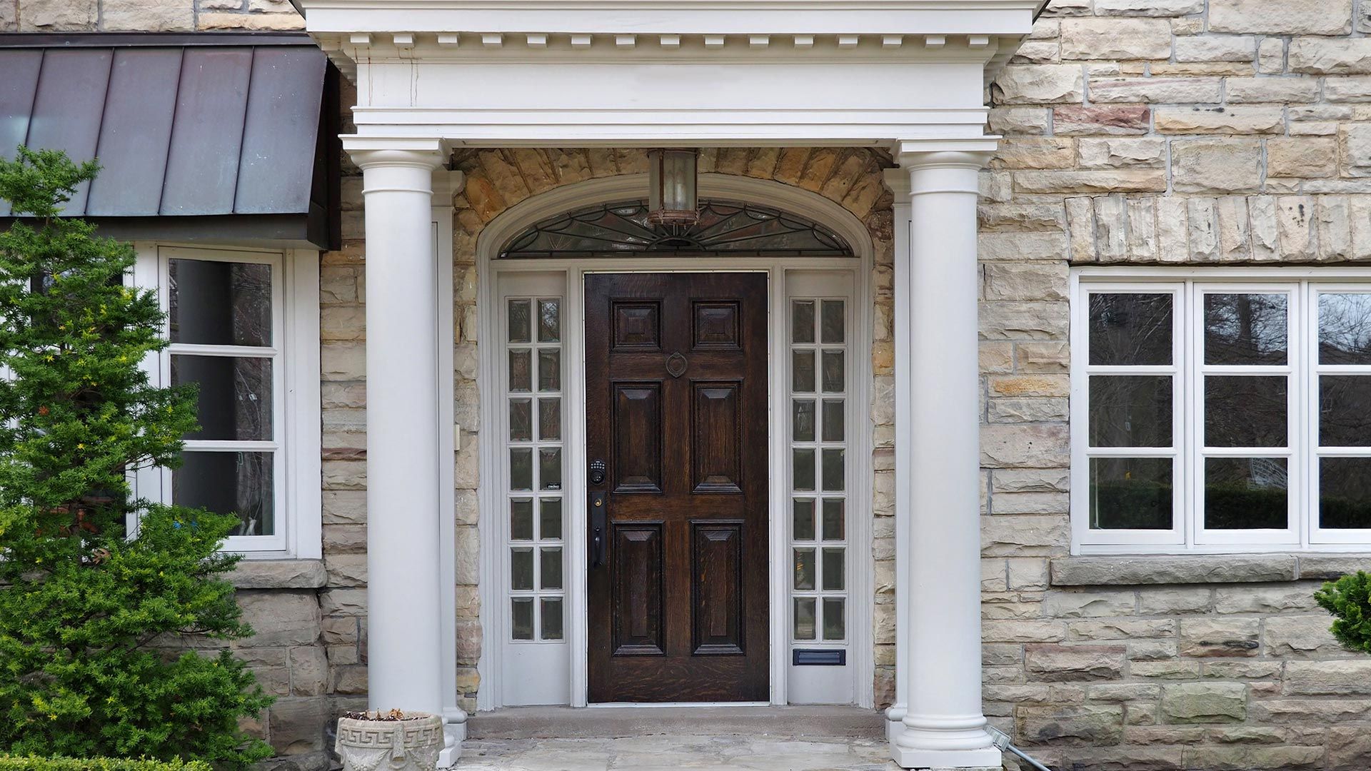 Brick House with a Porch and White Column – Moline, IL – QCFI Concrete & Masonry Brick House with a Porch and White Column – Moline, IL – QCFI Concrete & Masonry