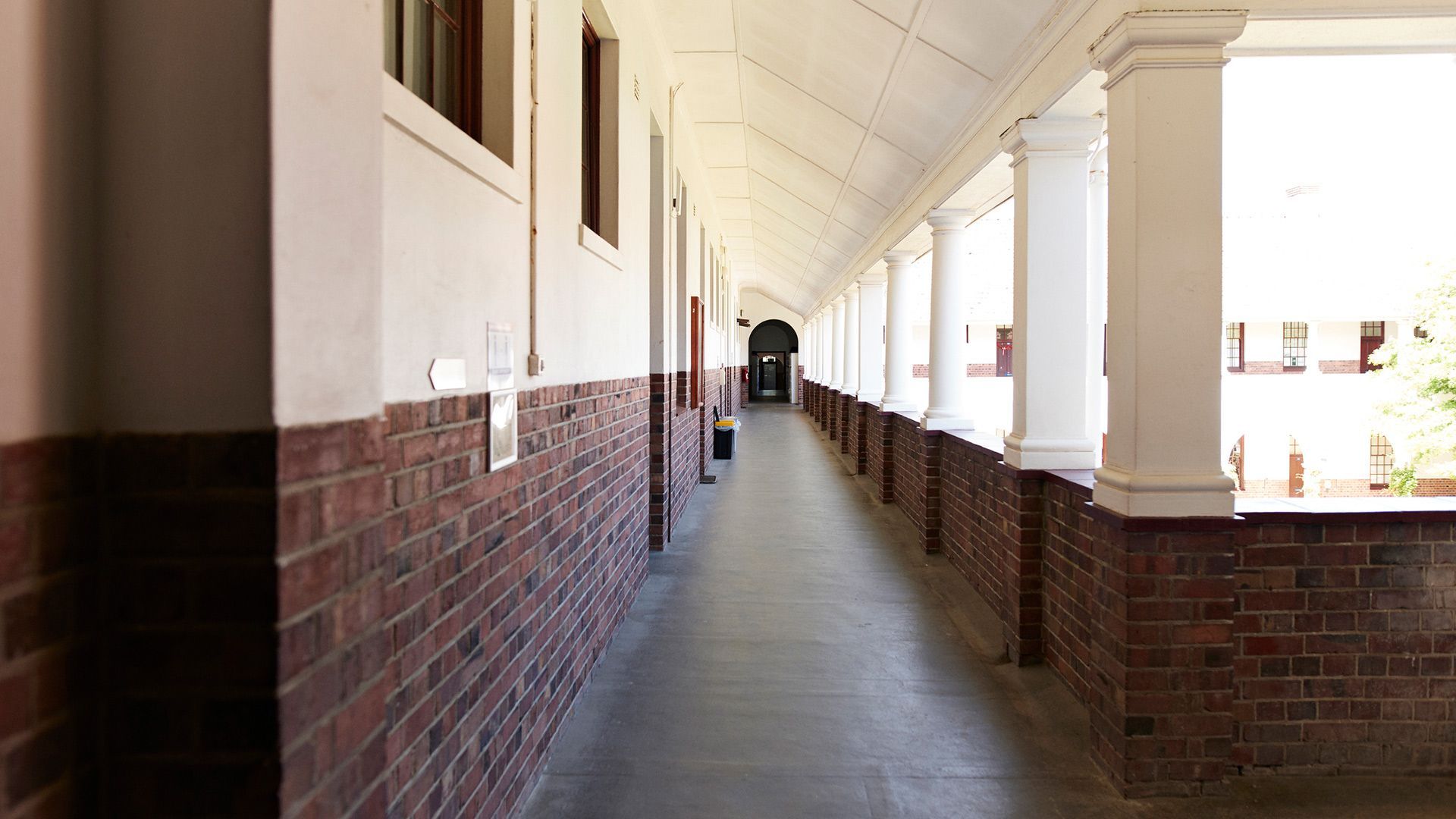 Hallway with Brick Walls and White Pillars – Moline, IL – QCFI Concrete & Masonry Hallway with Brick Walls and White Pillars – Moline, IL – QCFI Concrete & Masonry