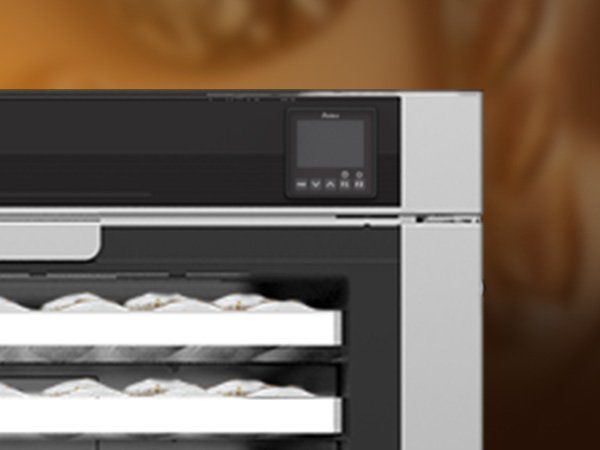 A close up of a stainless steel oven with a digital display.