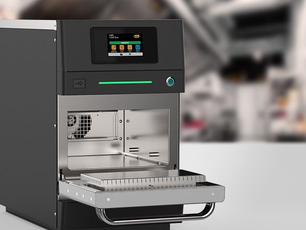 A machine with the door open and a screen on it
