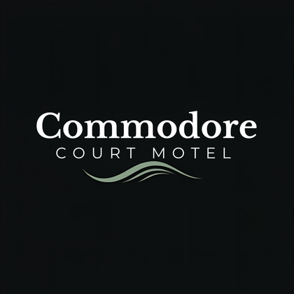 Commodore Court Motel logo on black background with white text and a green wave accent