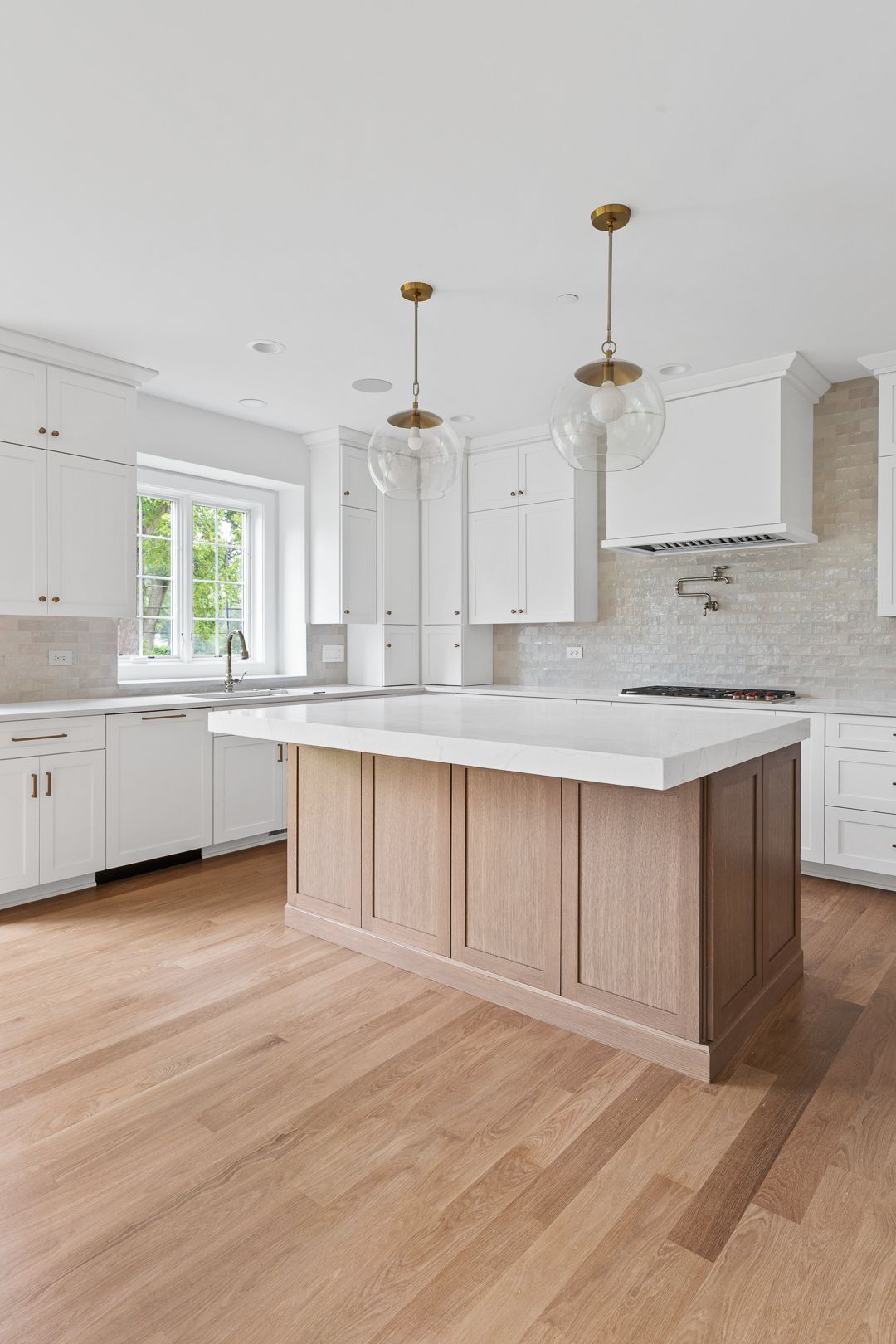There is a large island in the middle of the kitchen.