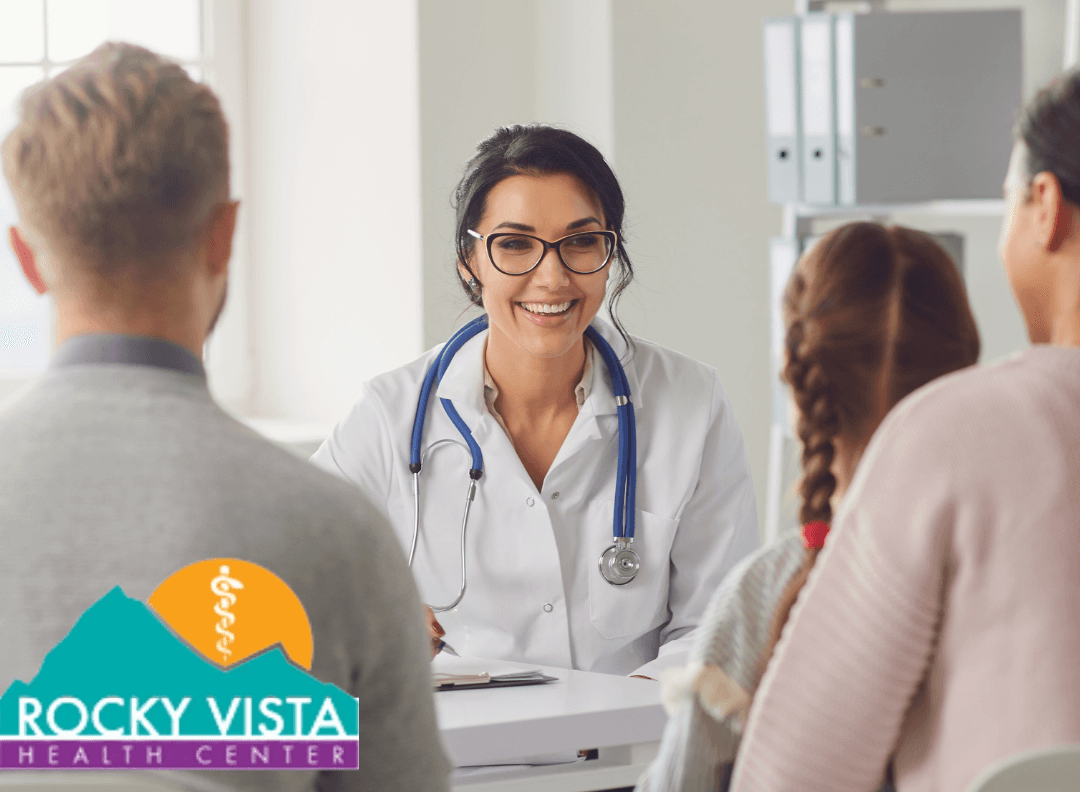 A doctor is talking to a family at a rocky vista health center