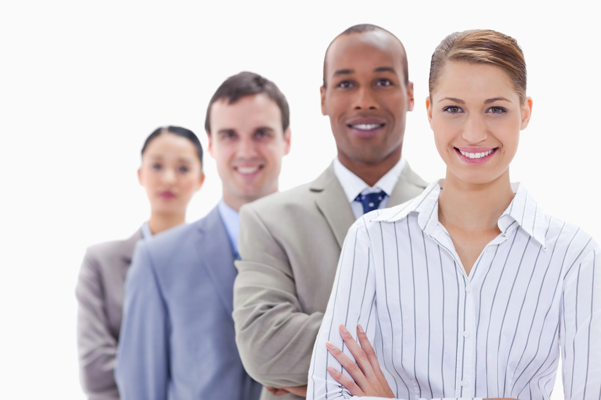 A group of business people standing in a line with their arms crossed