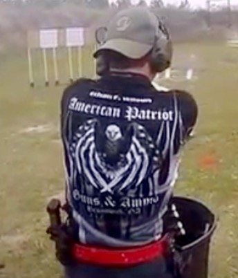 Man shooting at targets, wearing